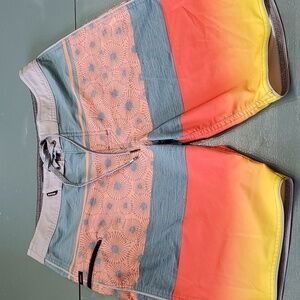 RIPCURL MIRAGE BOARD SHORTS. 30". BLUE, GRAY, ORANGE AND GRAY. TIE..